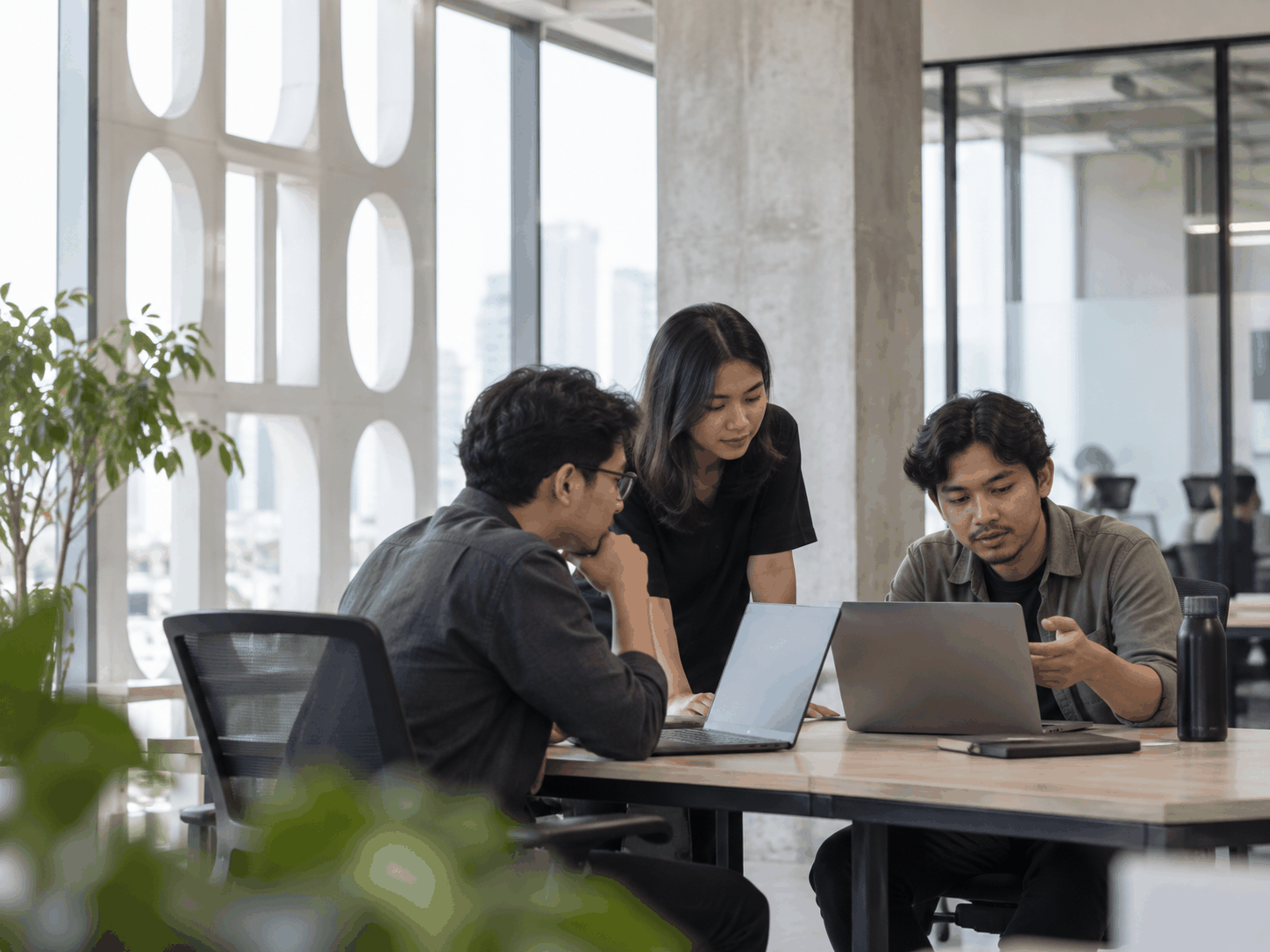 Engineering team in discussion at a modern studio